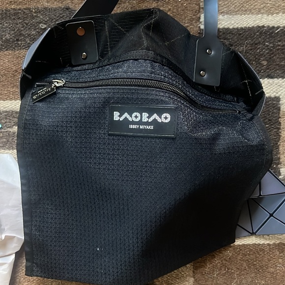 Issey Miyake Bao Bao tote in gray.